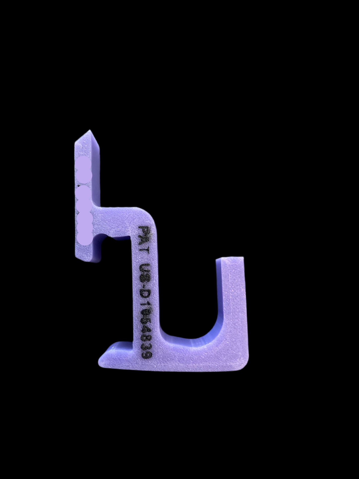 Purple plastic tool with 'INT/LARGE' text on a black background